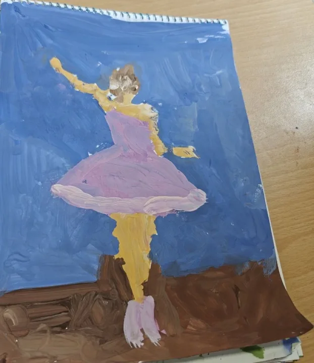 A child’s drawing of a ballerina in a pink tutu