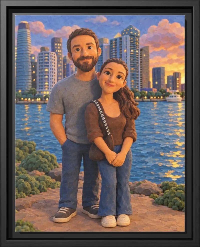 A couple rendered as handmade clay figures on a city waterfront, in a black floating frame
