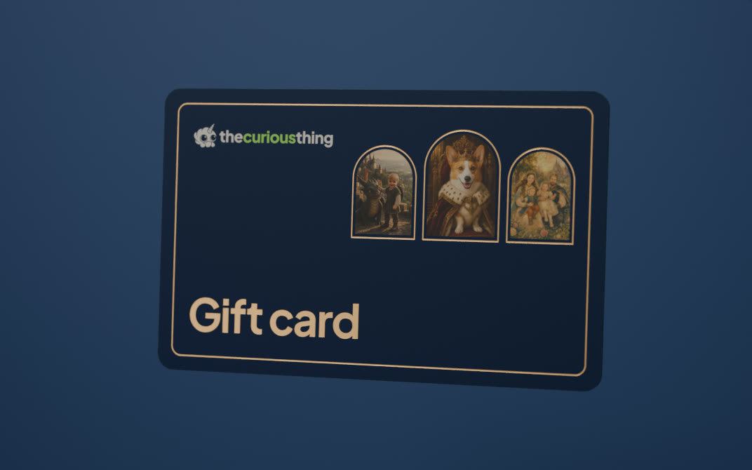 A navy gift card reading Gift card, with gold foil and three arched portraits, a child, a dog and a family, on a soft navy wall