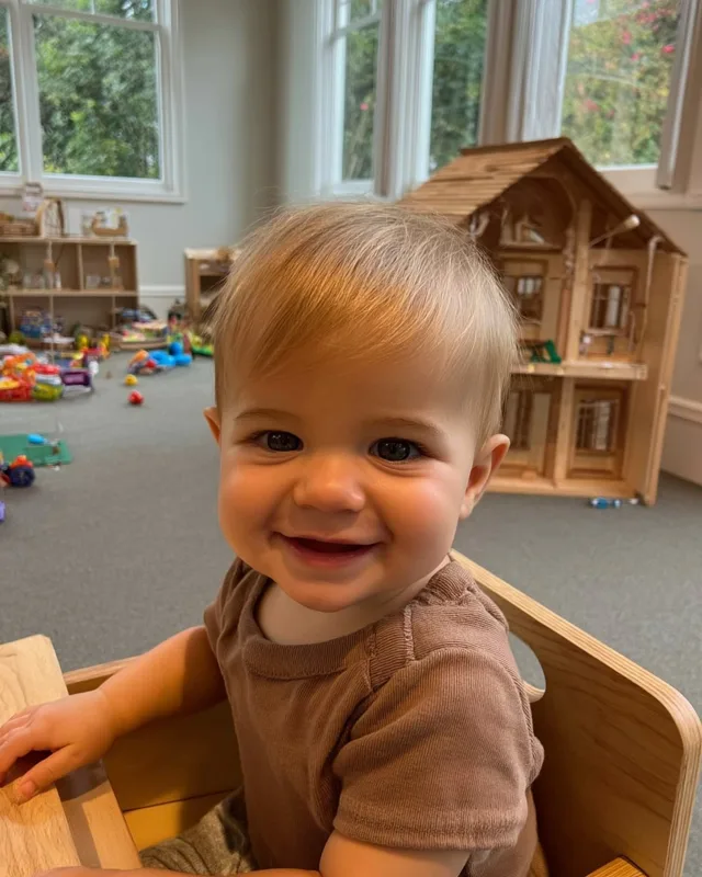 A photo of a smiling toddler