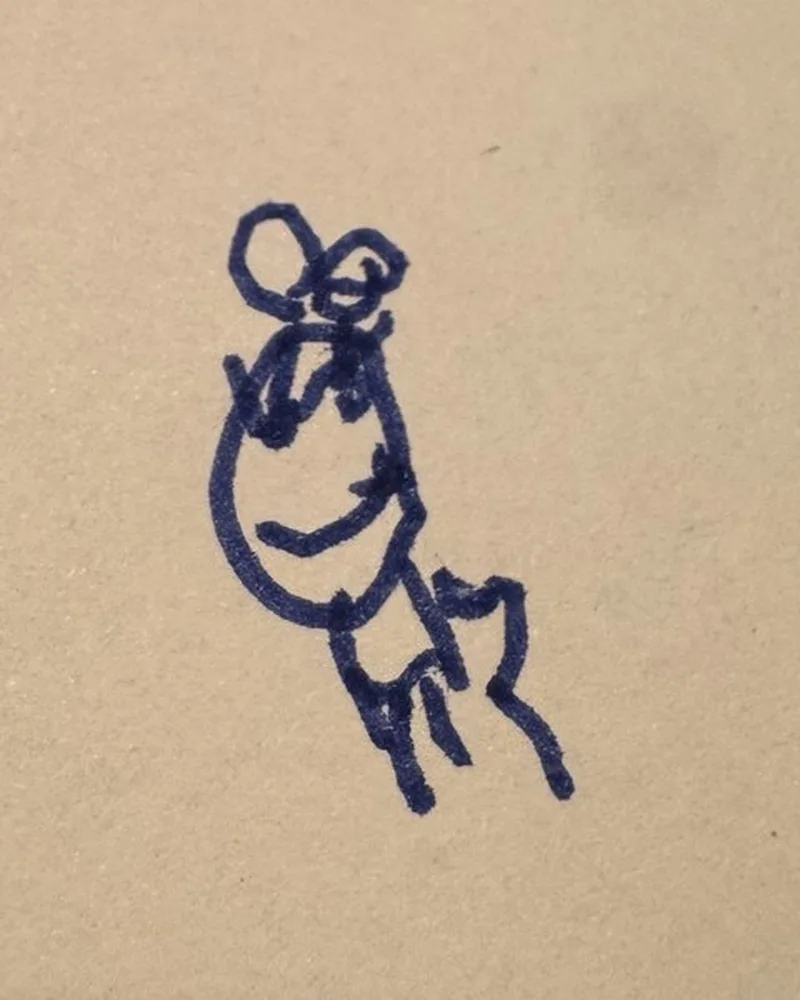 A child's blue pen drawing of a little figure