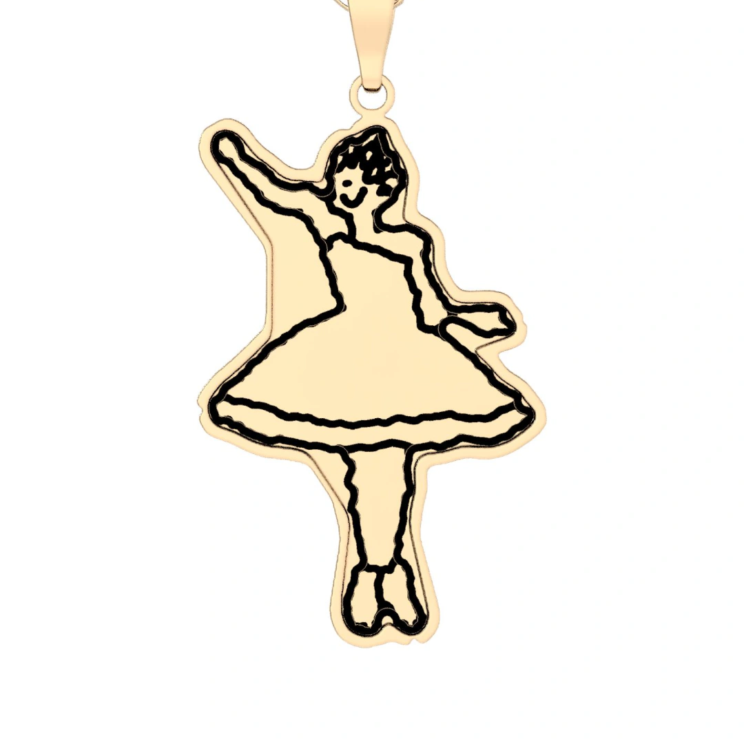 A child's drawing of a ballerina printed in black line on a gold pendant cut to the outline of the drawing