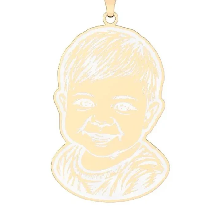 The gold pendant cut to the toddler's outline and engraved, rendered by the engraver
