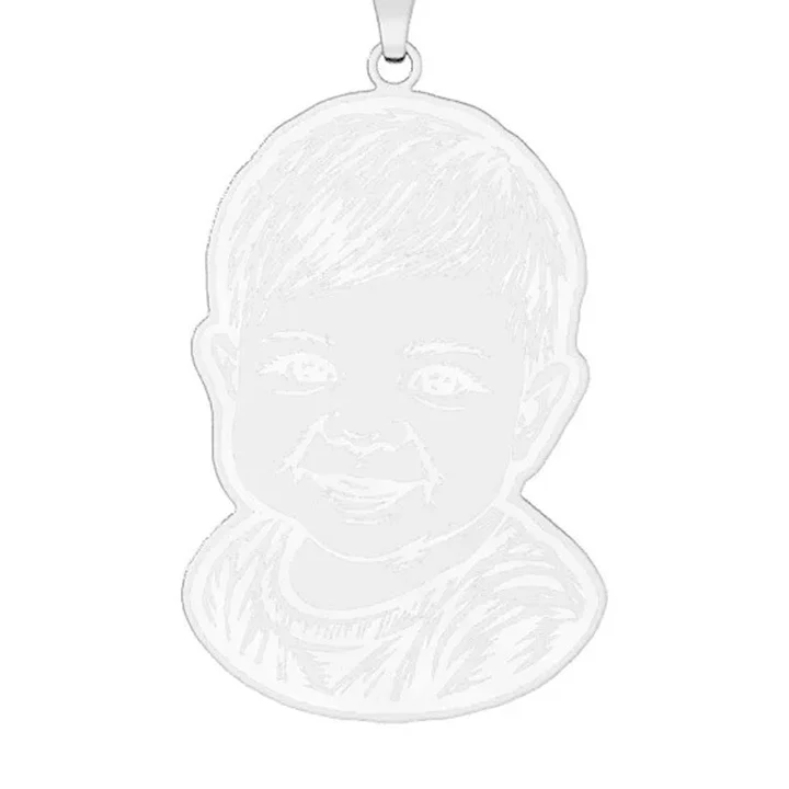 The linocut pendant in sterling silver, rendered by the engraver