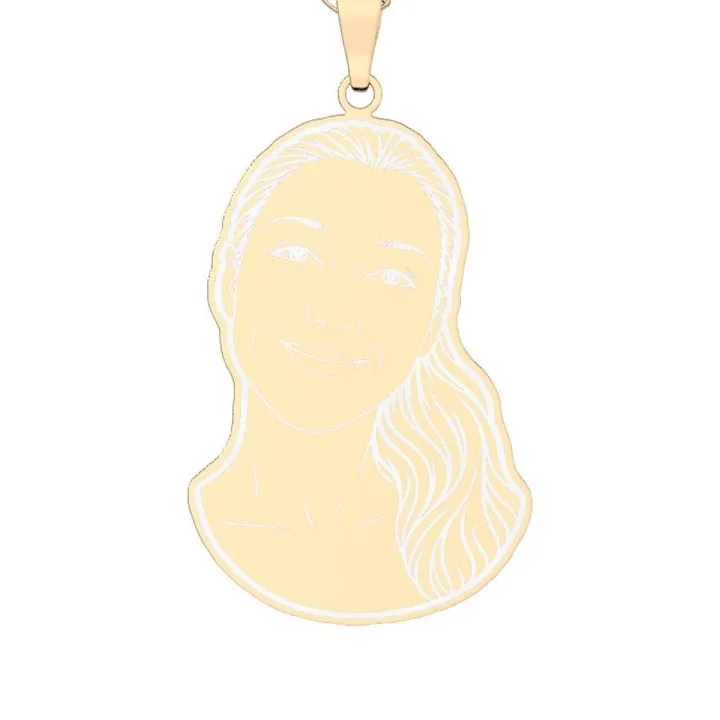 A woman’s face drawn in fine line, engraved on a gold plated pendant cut to its outline
