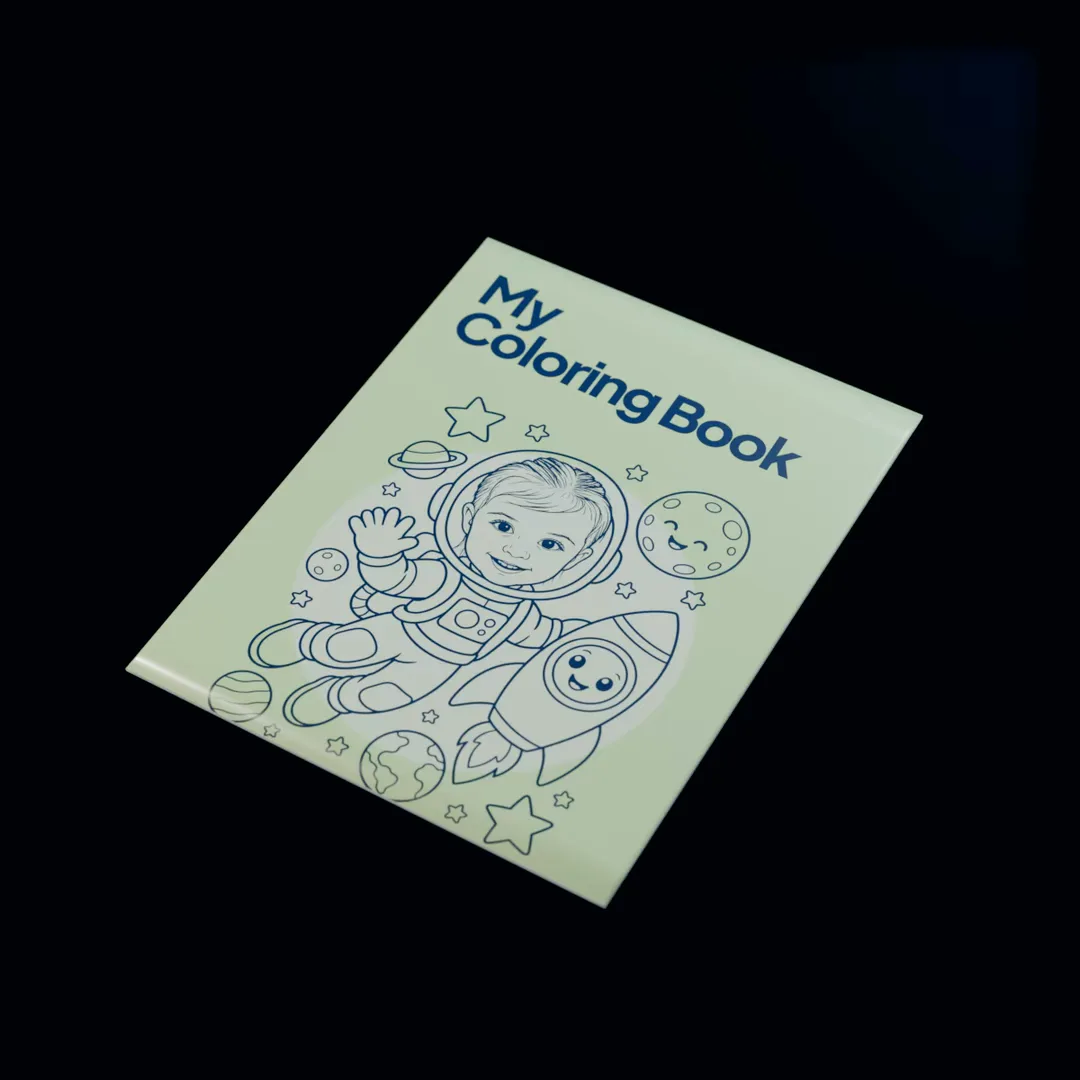 The printed coloring book titled My Coloring Book, a girl drawn as an astronaut in navy ink on its lime cover, opening onto pages of her as a mermaid and riding a unicorn