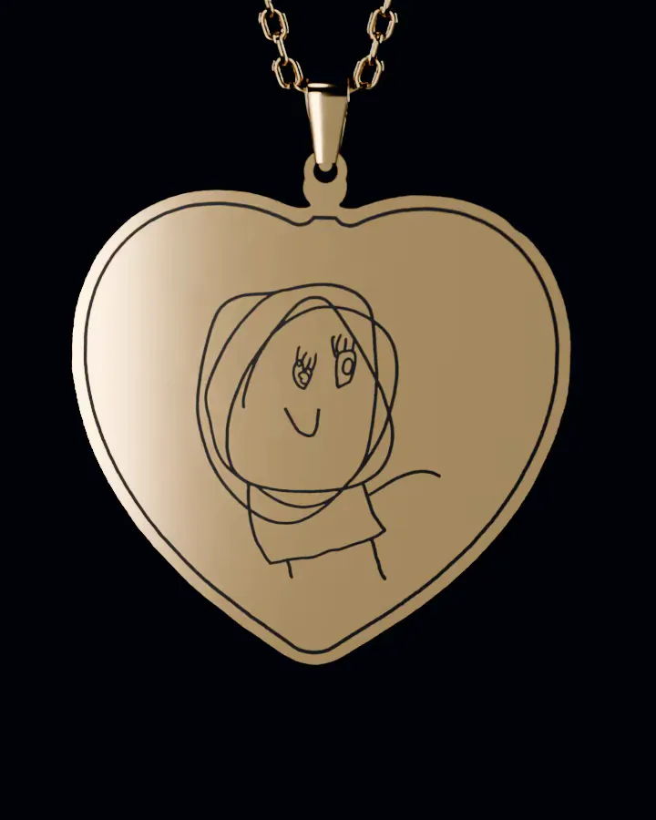 The drawing as a gold heart pendant on its chain, its lines printed in black