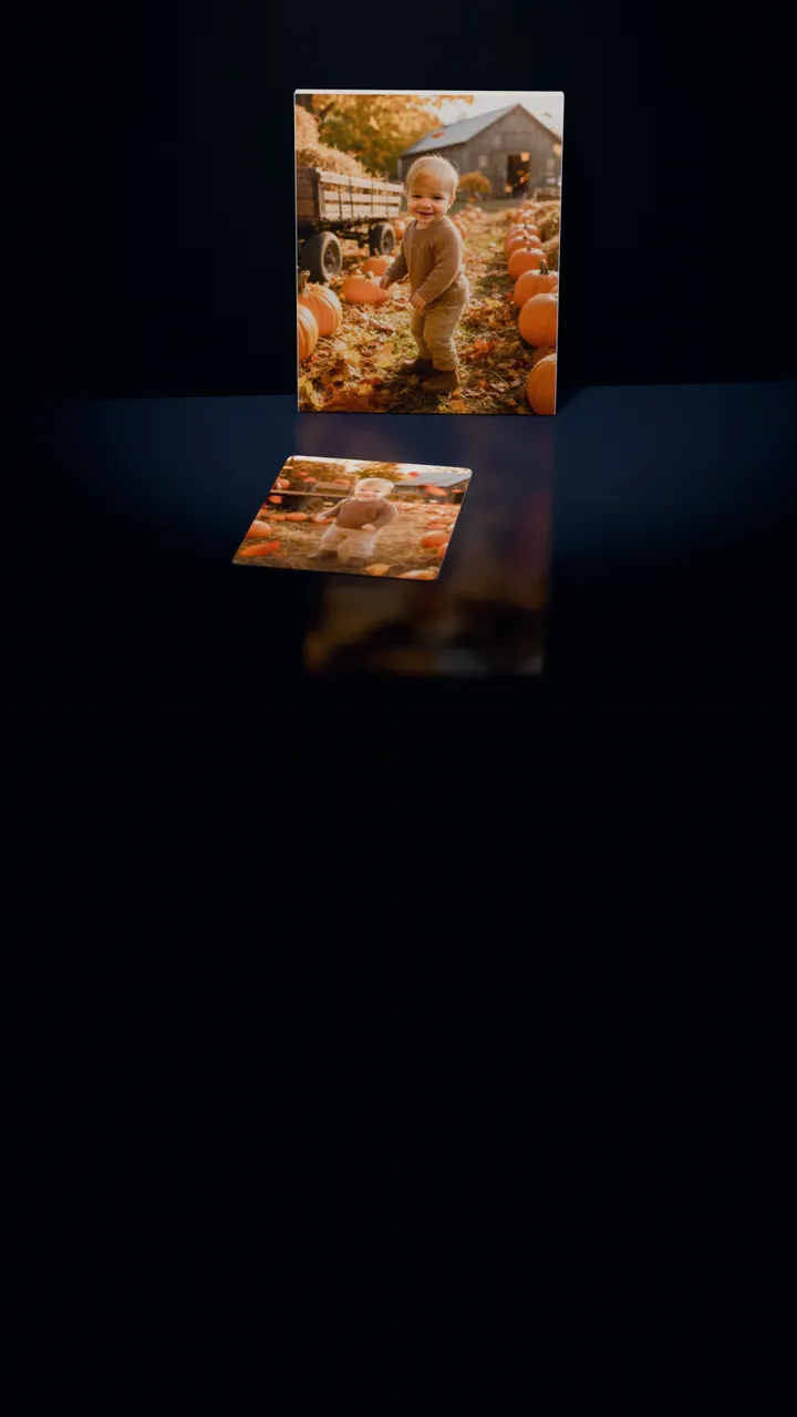 Two Autumn Harvest portraits in a dark room: one on a gallery canvas leaning against the wall, the other on a 30-piece puzzle in front of it, a piece lifting out of its slot, turning over and settling back
