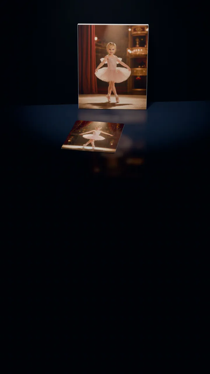 Two Prima Ballerina portraits in a dark room: one on a gallery canvas leaning against the wall, the other on a 30-piece puzzle in front of it, a piece lifting out of its slot, turning over and settling back