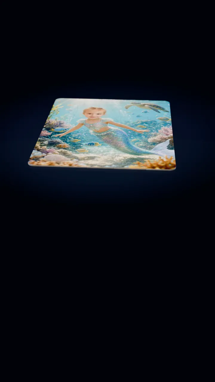 A 30-piece jigsaw puzzle of a little girl painted as a mermaid on a coral reef with a sea turtle lies on a dark table, and one piece lifts out of its slot, turns over and settles back in